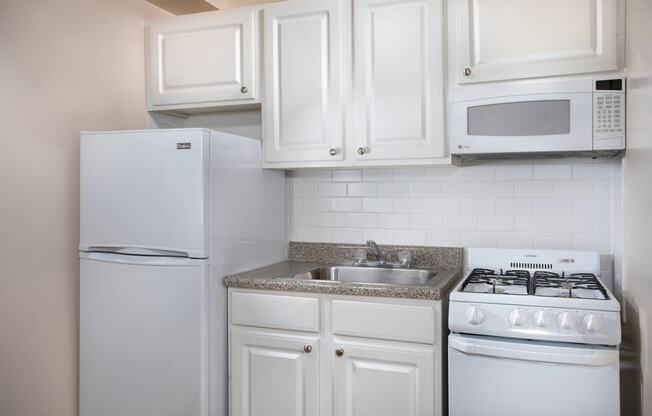 kitchen with gray counter tops at Miramar, Washington, Washington