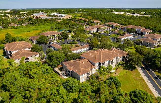 arial view of a subdivision with houses and trees at Heritage Bay, Florida, 34957