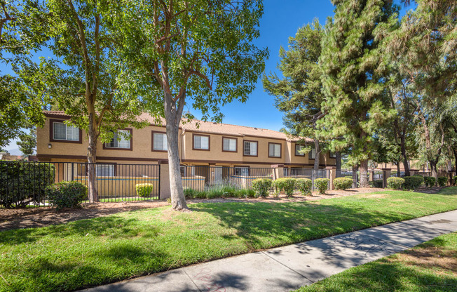 our apartments offer a spacious courtyard with green grass and trees