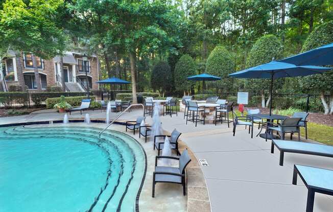 a swimming pool with chaise lounge chairs and umbrellas