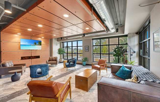 a large living room with furniture and large windows