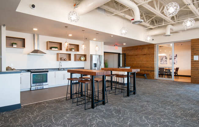A kitchen with a bar area and a dining table.