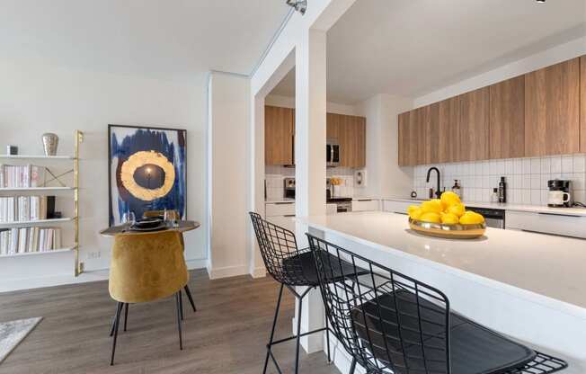 a rendering of a dining room with a geometric design on the wall