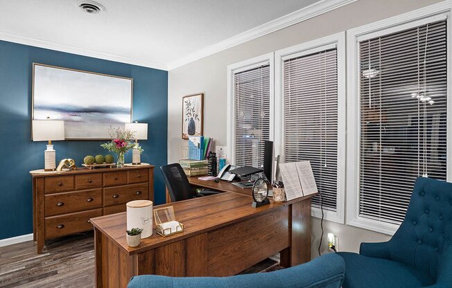 a home office with a desk and a chair