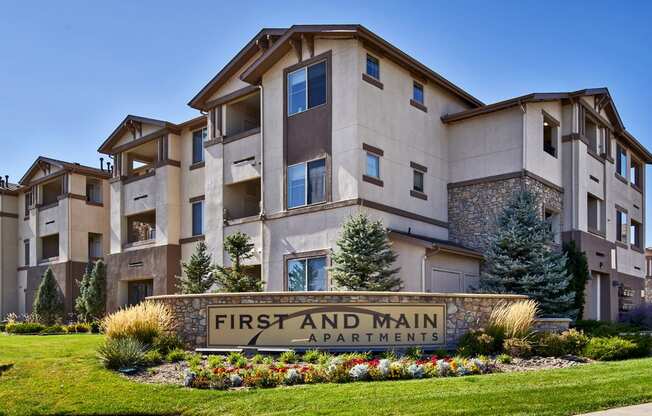 First and Main Apartments welcome sign and landscaping
