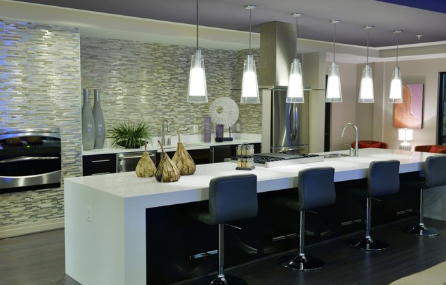 Resident lounge with kitchen for entertaining at Mira Upper Rock, Rockville, Maryland