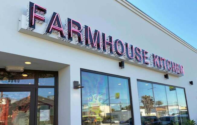 The front of a building with a sign that says Farmhouse Kitchen.