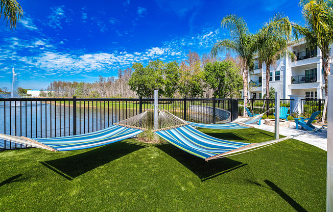 a composite image of a hammock on the grass next to a pool at Altis Grand Suncoast, Land O' Lakes, 34638