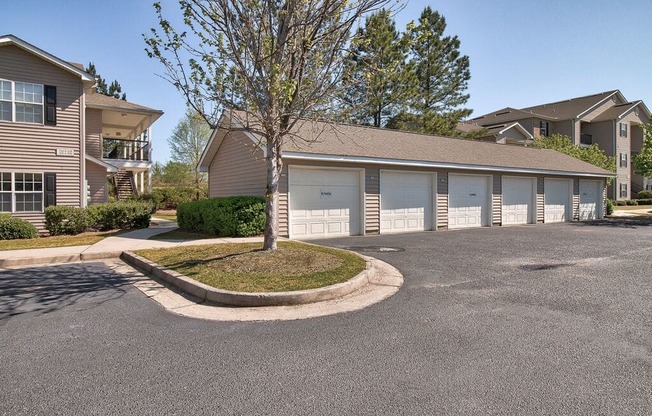 a building with garages and a street in front of it