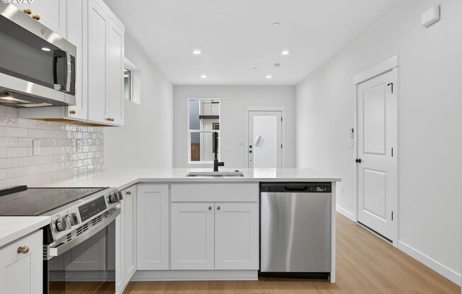 Brand-New 2-Bedroom Home with White Granite Kitchen, Open-Concept Living & Attached Garage