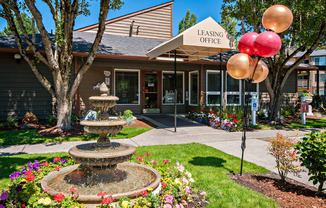 Hunt Club Apartments Clubhouse Exterior Entry With Fountain & Balloons Side View