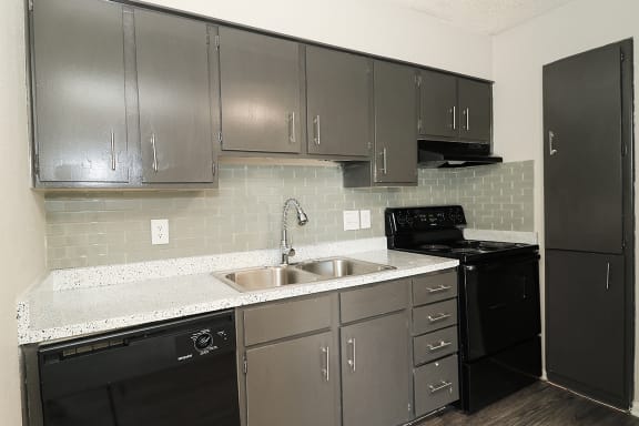 black appliances with grey cabinets
