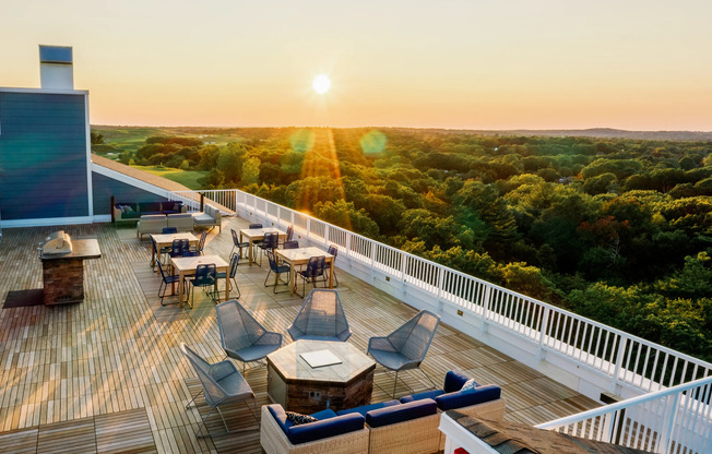 Rooftop at sunset at The Q | Apartments In Quincy