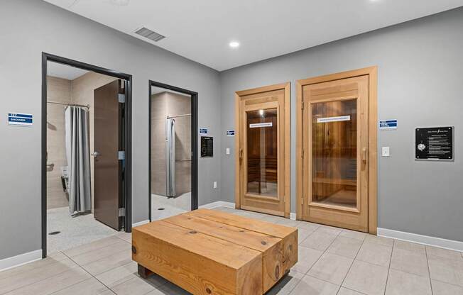 A room with a wooden table and four doors.