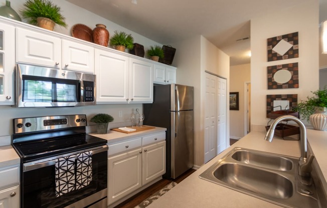 This is a photo of the kitchen in the 2 bedroom, 2 bath Islander floor plan at Nantucket Apartments in Loveland, OH.