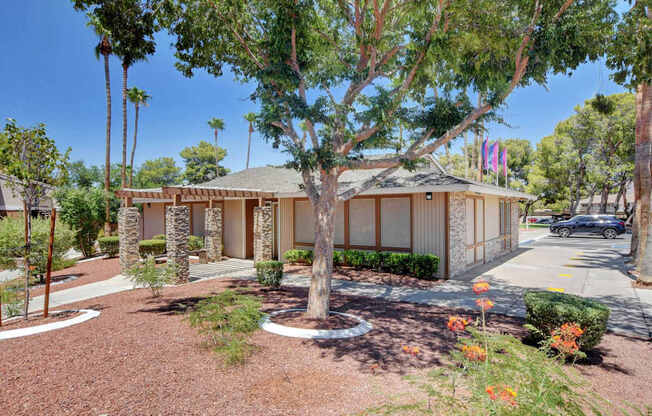 A house with a brown roof and a brown fence.