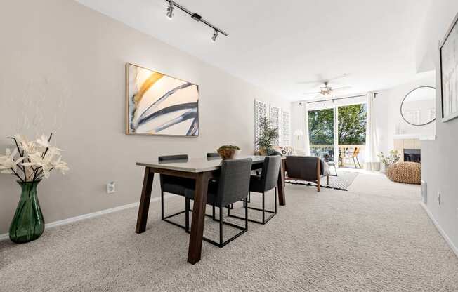 a dining room with a table and chairs