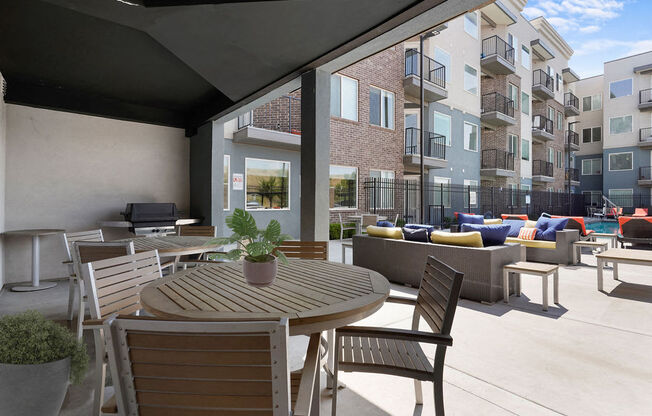 a rendering of a patio with tables and chairs