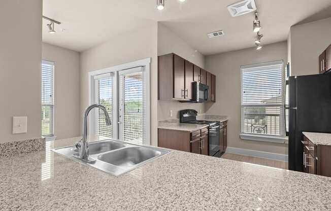 a kitchen with a sink and a window