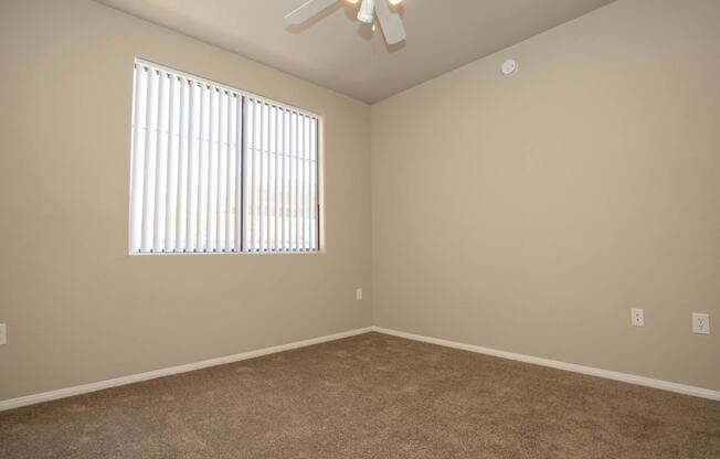 Unfurnished room with wooden floor and ceiling fan at The Cantera by Picerne, Las Vegas, Nevada