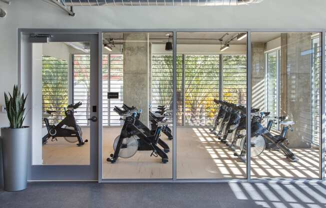 Two-Bedroom Apartments in Woodland Hills, CA - The Q Variel - Spin Studio with Floor-to-Ceiling Windows and Complimentary Fitness Classes