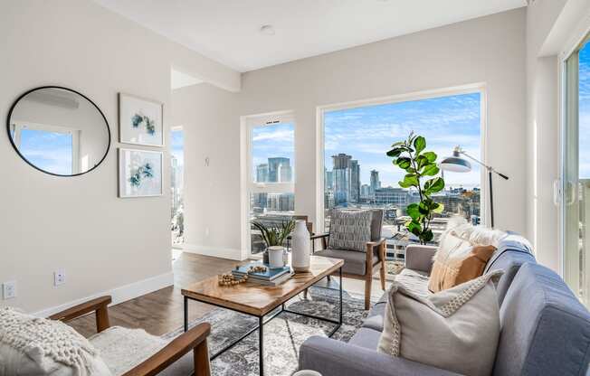 an open living room with a view of the city  at Oslo, Seattle, WA