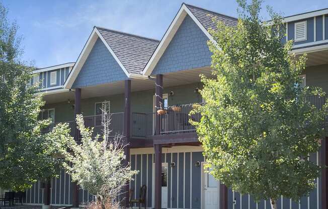 a house with two trees in front of it at King West One, Montana, 59106
