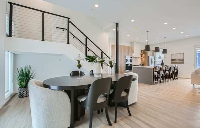 a dining room with a table and chairs