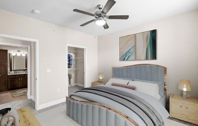 a bedroom with a bed and a ceiling fan