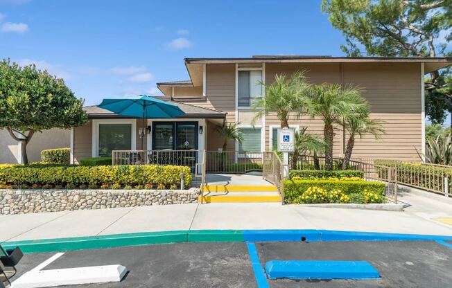 a house with a trampoline and a pool in front of it