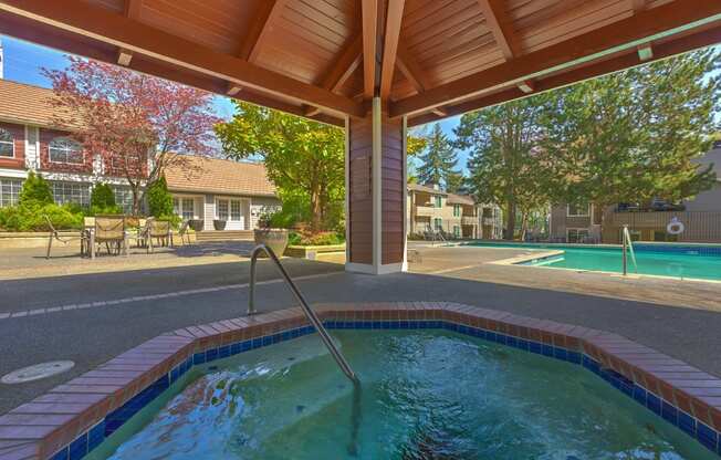 a resort style pool is under a wooden roof