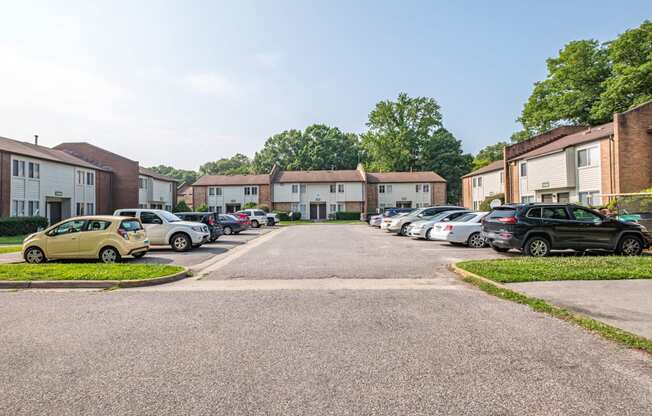 a parking lot in front of a row of houses