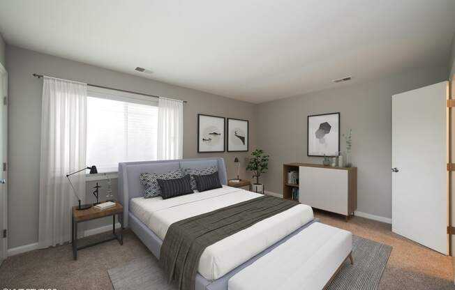 a bedroom with a bed and a dresser in a 555 waverly unit