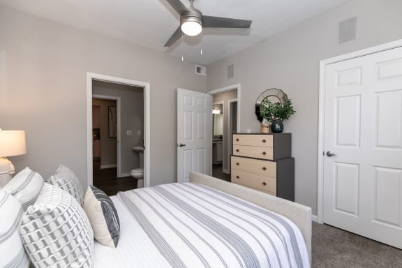 a bedroom with a bed and a dresser and a ceiling fan at Willowest in Collier Hills, Atlanta, GA