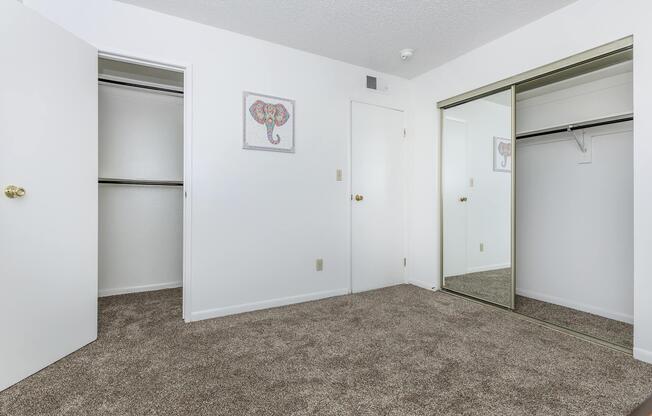 bedroom with two closets