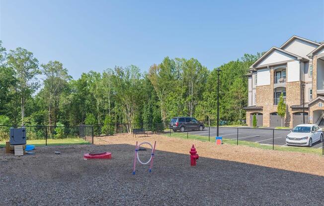 Fenced in dog part at the Pet-Friendly with One White Oak apartments.