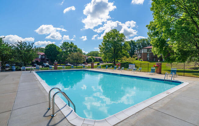 Relaxing Swimming Pool With Lounge Chairs at Old Farm Apartments, Elkhart