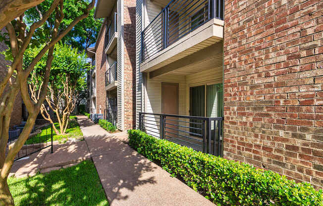 Apartment building exterior at Canyon Creek Apartments in the Dallas Midtown neighborhood of Dallas, TX.
