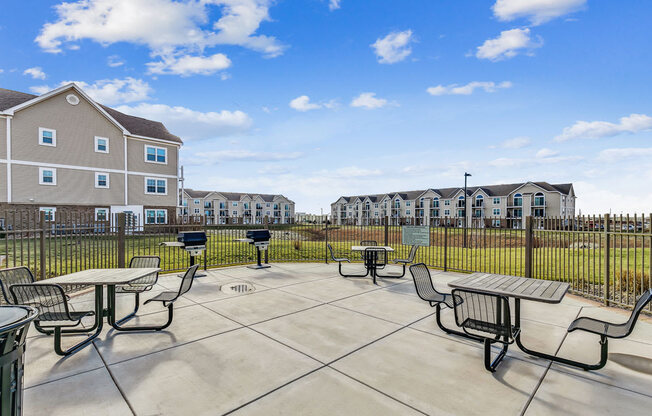 Grilling Area with Seating at Stoney Pointe Apartment Homes in Wichita, KS