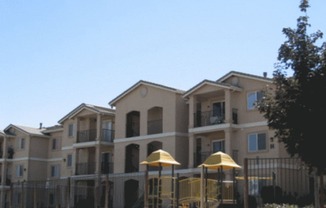 Boulder Creek View of Apartment Exterior and Playground