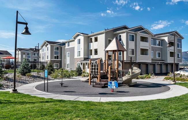 Children's Playground with Slide at Three Bedroom Apartments in Colorado Springs 80921