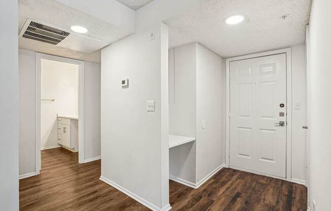 A white door is on the right side of the image.