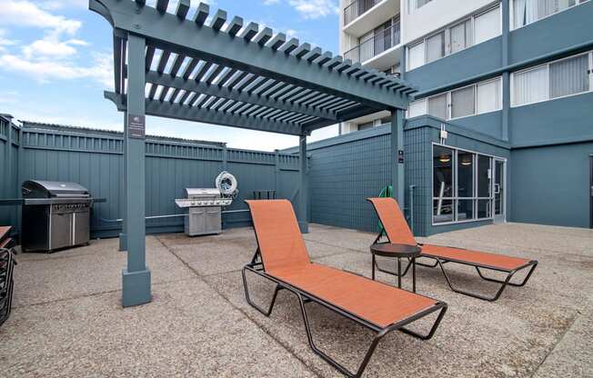 avenue two lounge chairs and grill area at Avenue Two Apartments, Redwood City  , CA 94063