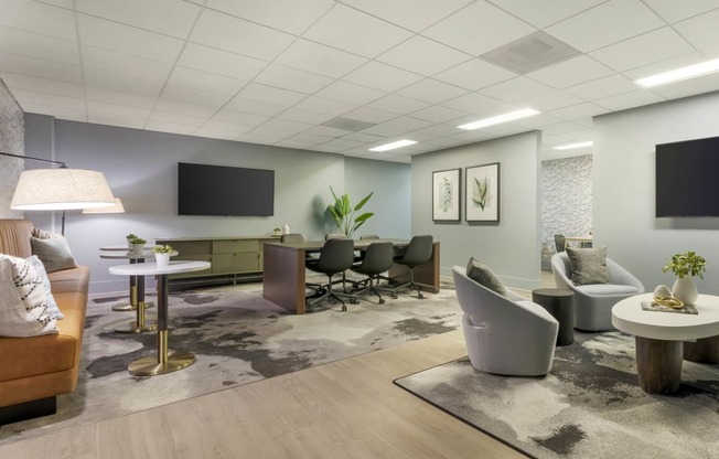 a living room with couches and chairs and a tv  at Vue, San Pedro, CA