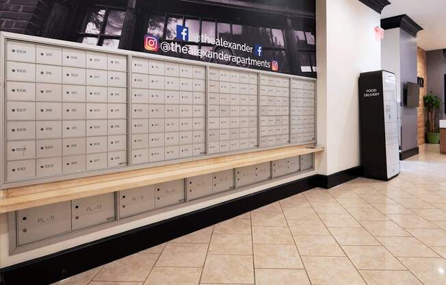 A wall of mailboxes with the numbers 1001 to 1011 on them.