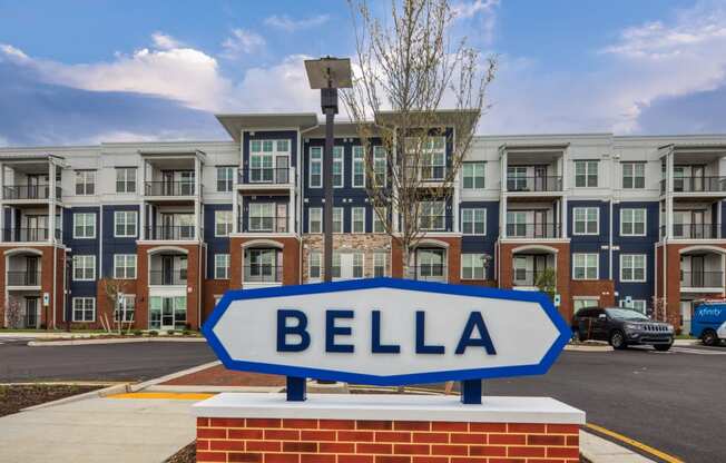 an arrow sign in front of an apartment building at The Bella at Westchester, Midlothian, VA, 23113