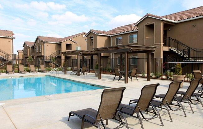 Soak in the sun on our pool deck at Greystone Apartments