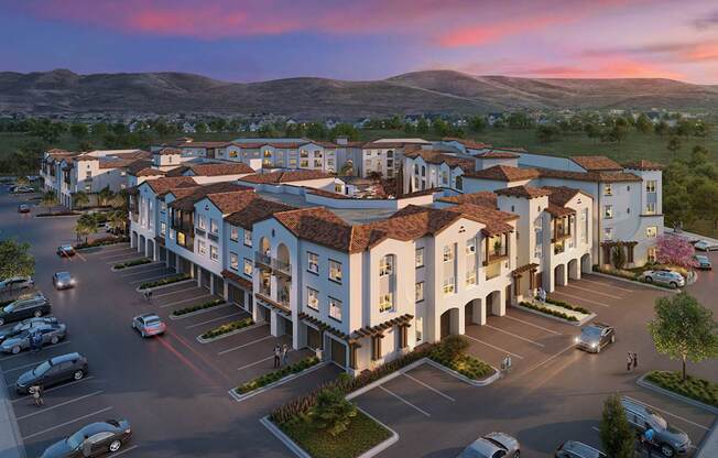 A large hotel with a parking lot in front of it at Pradera Apartments, CA, 94582