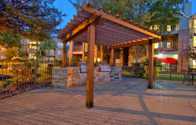 Stainless steel barbecues under a pergola