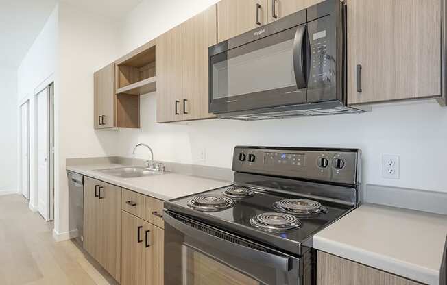 1 BR Apartments in Mill Creek WA - Farm By Vintage - Modern Kitchen with Wood-Style Cabinets